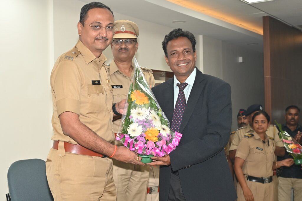 Police officer receives bouquet at job fair event